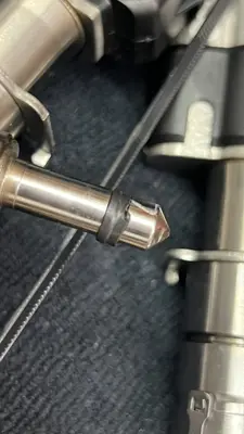 Damaged fuel-injector Teflon seal I replaced — easy to ruin on install; took several tries to seat without tearing.