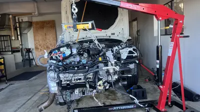 Lower block / starter region — wiring and exhaust proximity.