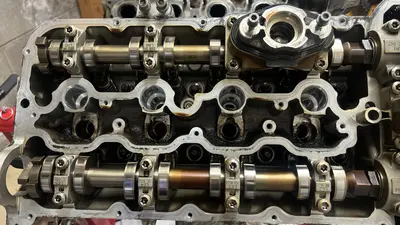 Left head — cams ready to come out for cleaning.