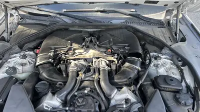The starting point: engine can't be turned over at the crankshaft, but otherwise looking not so bad on the surface — lots of oil underneath.