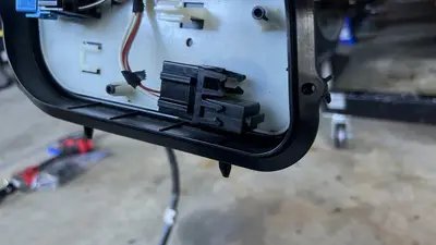 Lower engine electrics near the starter mount.