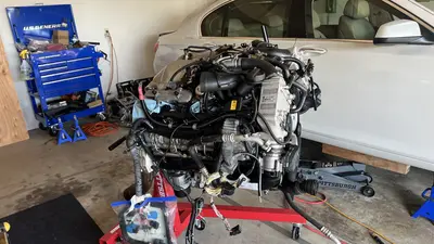Long block on the stand — side dress-up before lifting back toward the car.