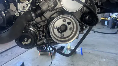 Crank pulley face — center bolt and surrounding Torx fasteners.