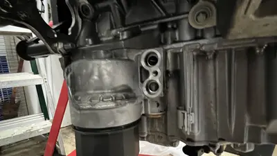 Lower block and oil-filter housing area, cleaned up on the stand.