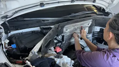 Empty bay — heat shield and remaining hoses tucked for the install.