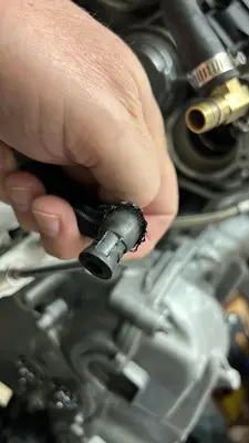 Fitting a plastic elbow onto a braided line during dress-up.