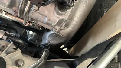 Front plumbing in the bay — quick-connects and vacuum lines.