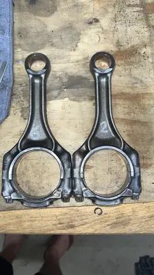 Connecting rods are bi-directional — same both ways; one face marked, the other blank.