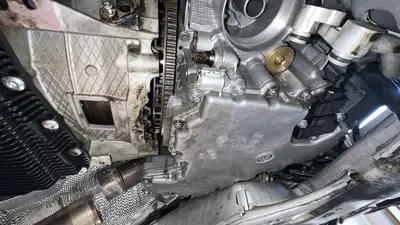 Oil-pan side sensors and harness clips after the engine is in.